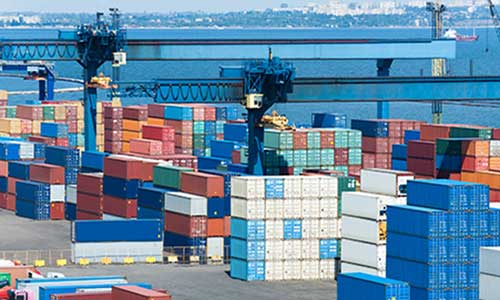 container yard with stacks of storage containers