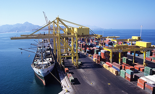 port loading cargo freights to cargo ships for shipping