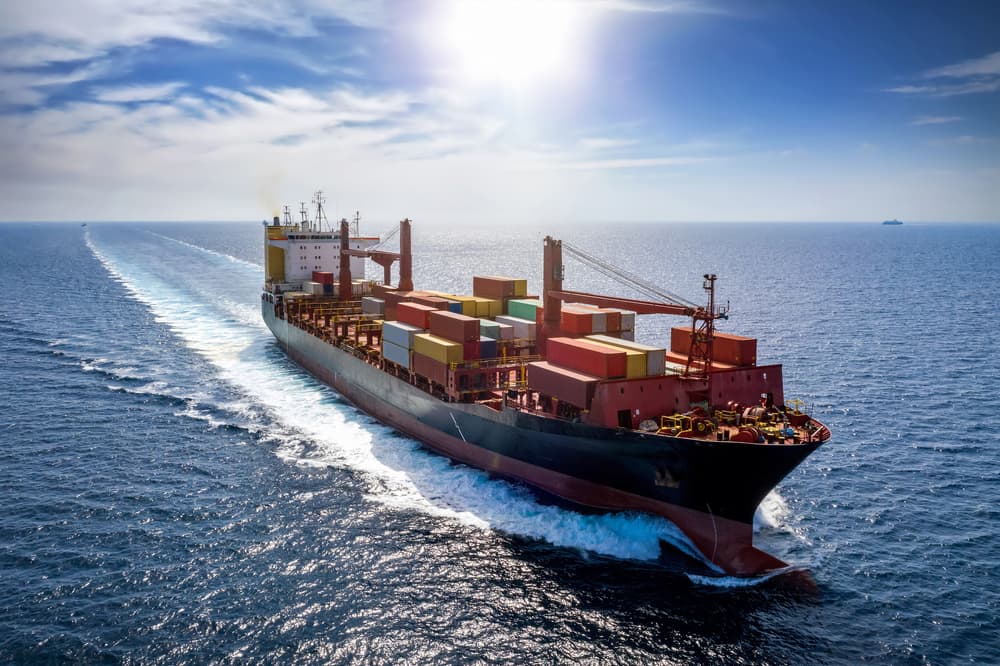 angled view of a cargo ship moving at the sea