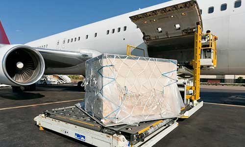cargo box being loaded on a freight plane