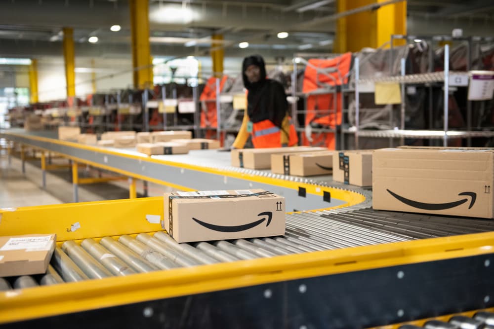 small amazon box on an assembly line