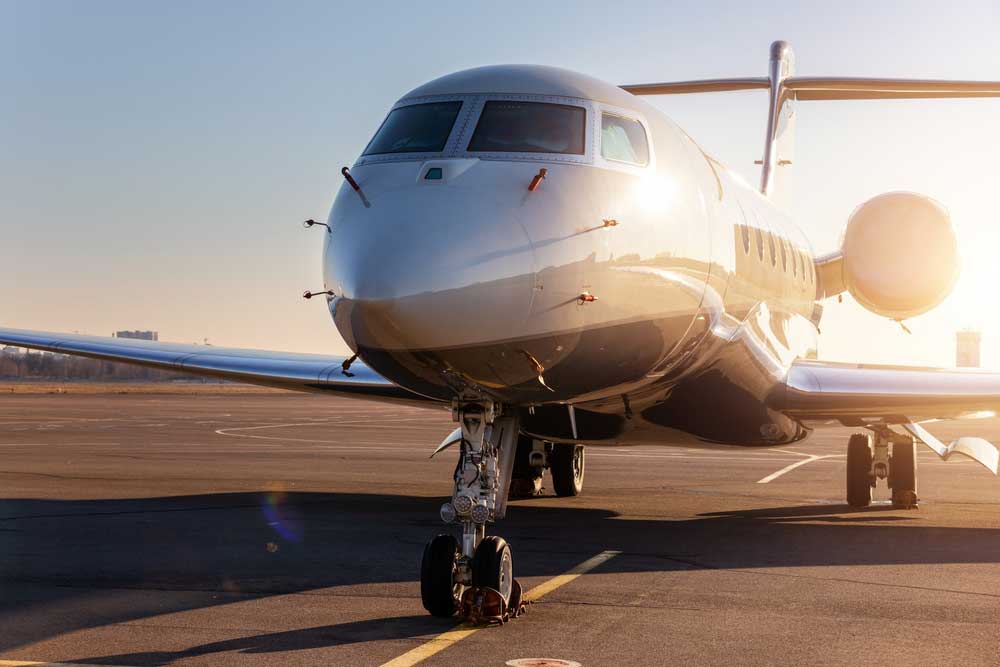 airplane parked on an empty runway