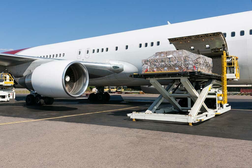 plane taking in cargo for delivery