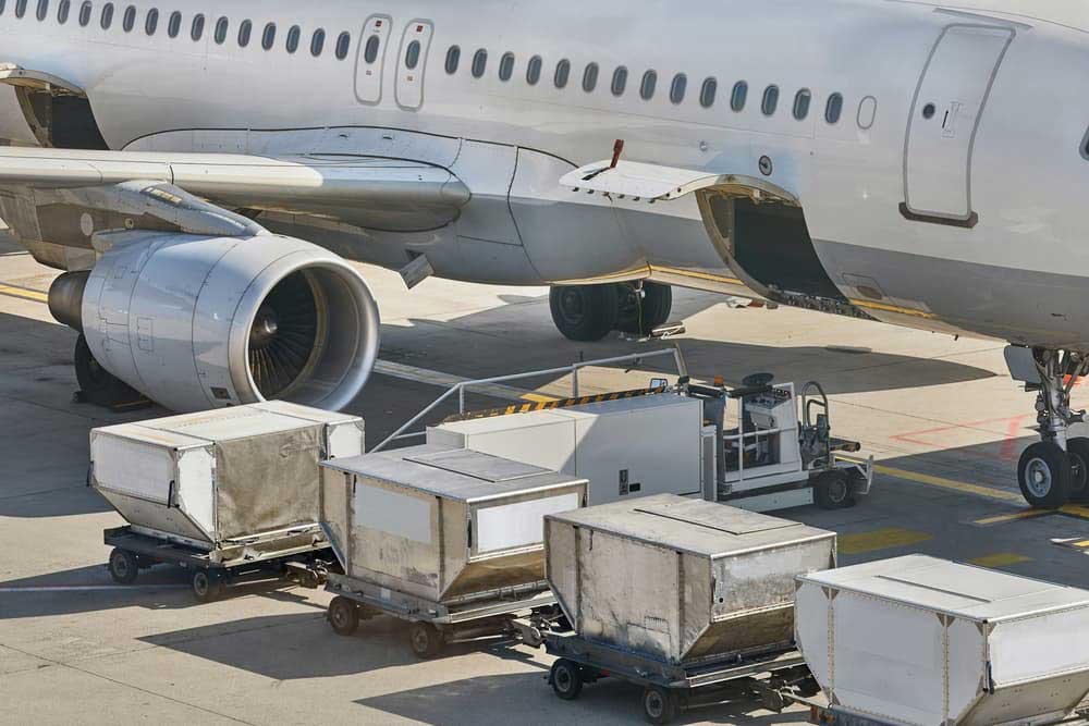 freight plane being loaded with cargo for delivery