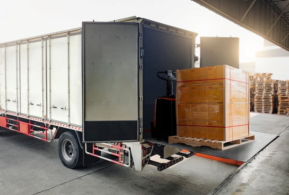 cargo box being unloaded from delivery truck