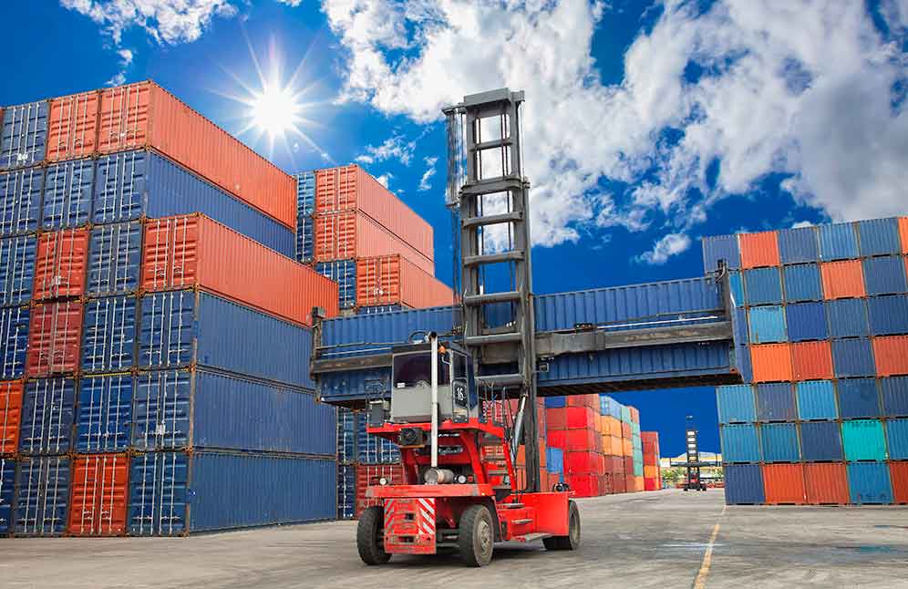 several storage containers and a red forklift