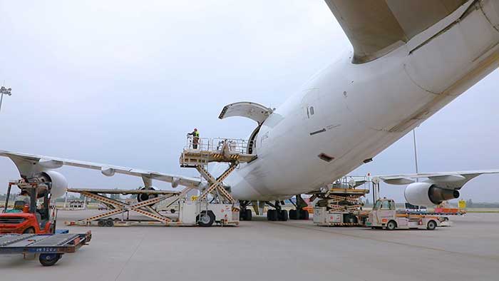 plane on landing strip waiting for load