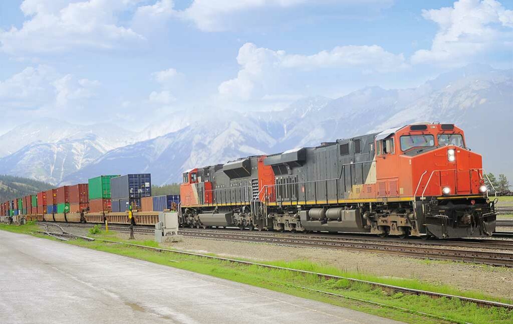 delivery train carrying storage containers moving on a wide field