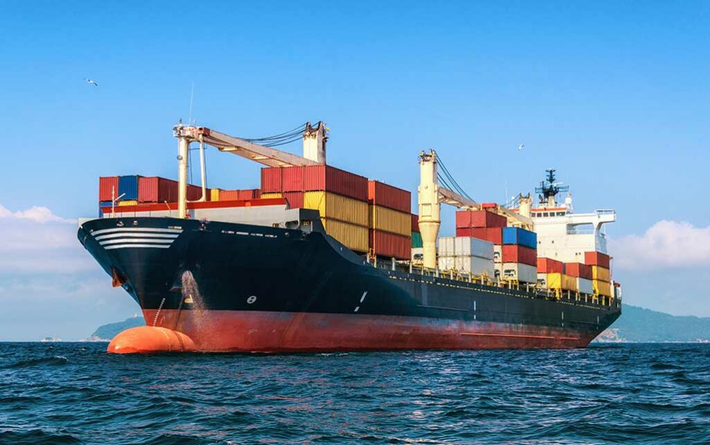 black cargo ship sailing at the sea