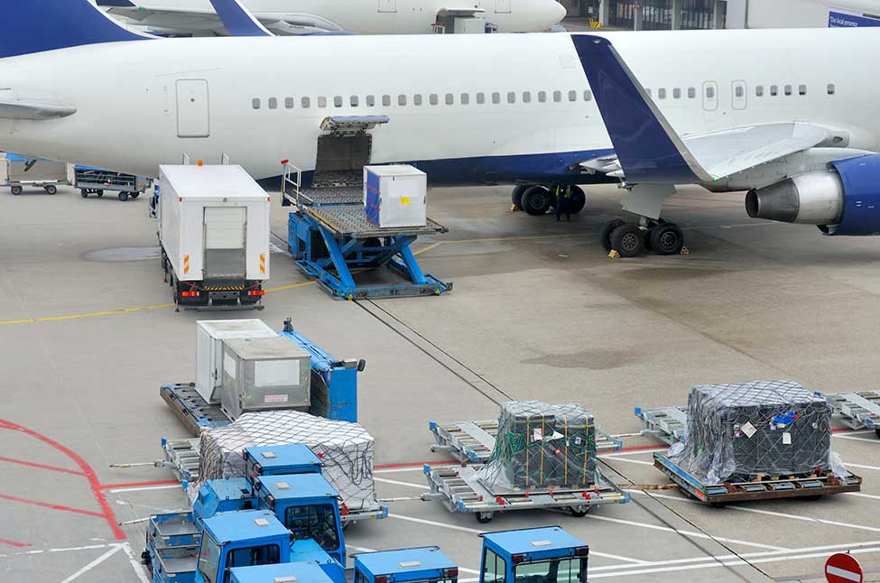 several cargo packages en route to load a plane