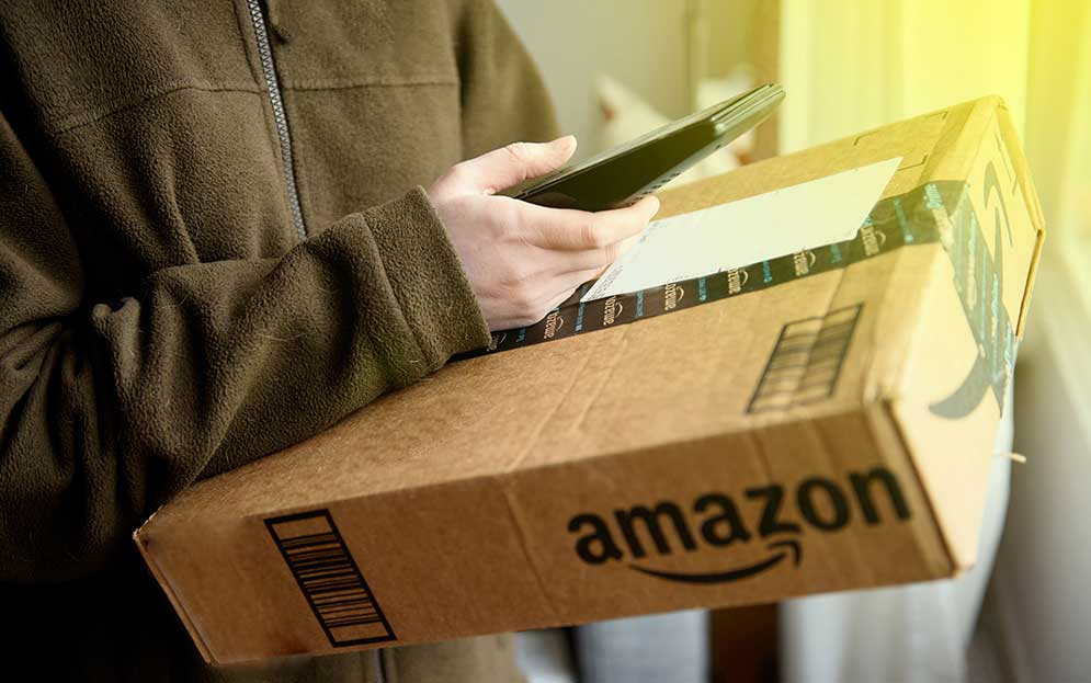 man scanning details of an amazon package