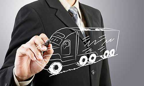 man in suit drawing a cargo truck using white inked pen