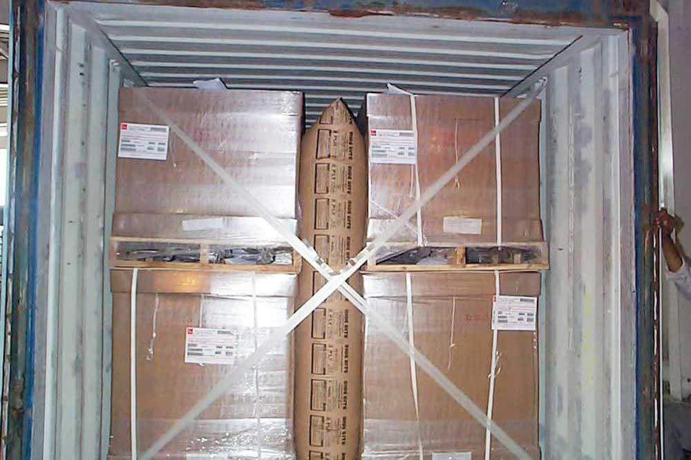 stacked packages secured in a cargo container